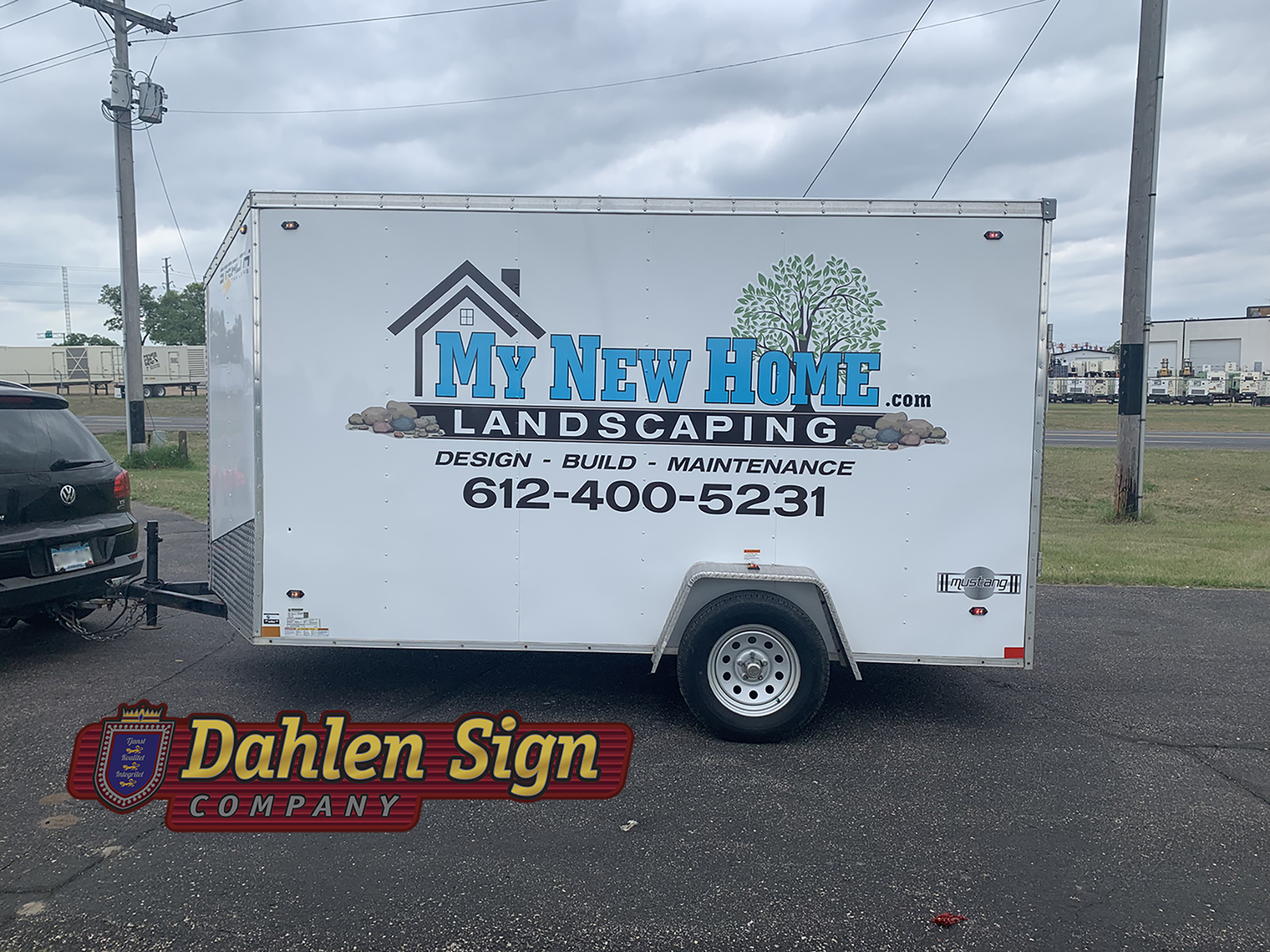 Custom vinyl trailer graphic designed for My New Home Landscaping by Dahlen Sign Company